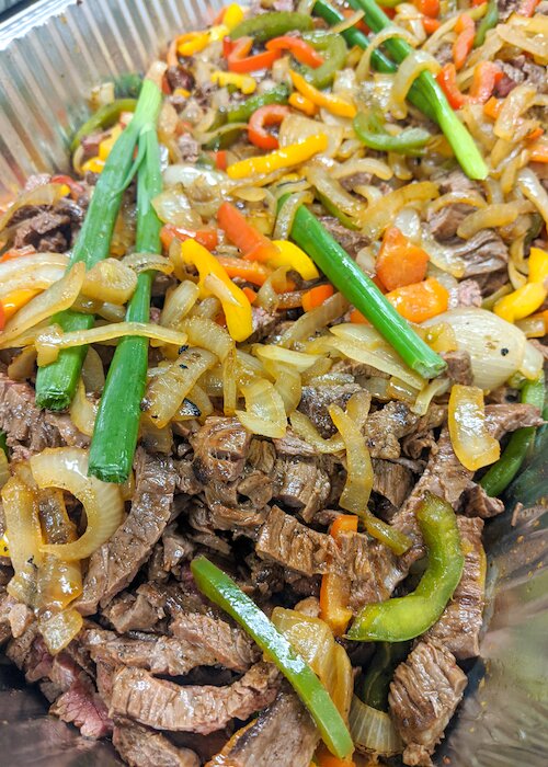 Steak fajitas with onions and peppers}